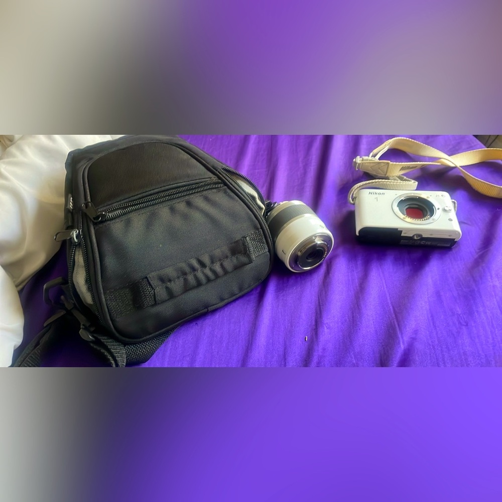 Comes with camera bag, lenses, and battery charger.